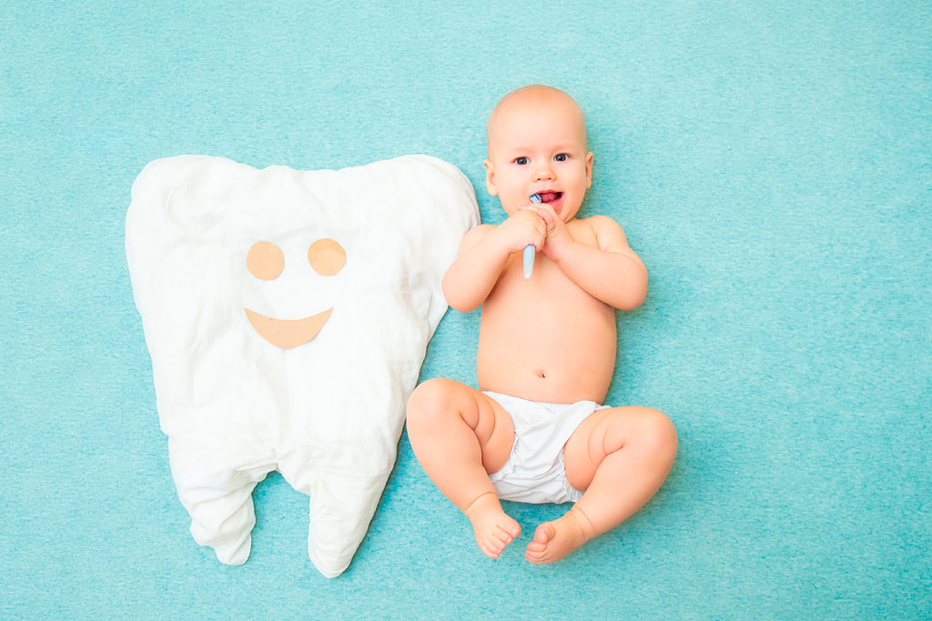 levar bebé ao dentista